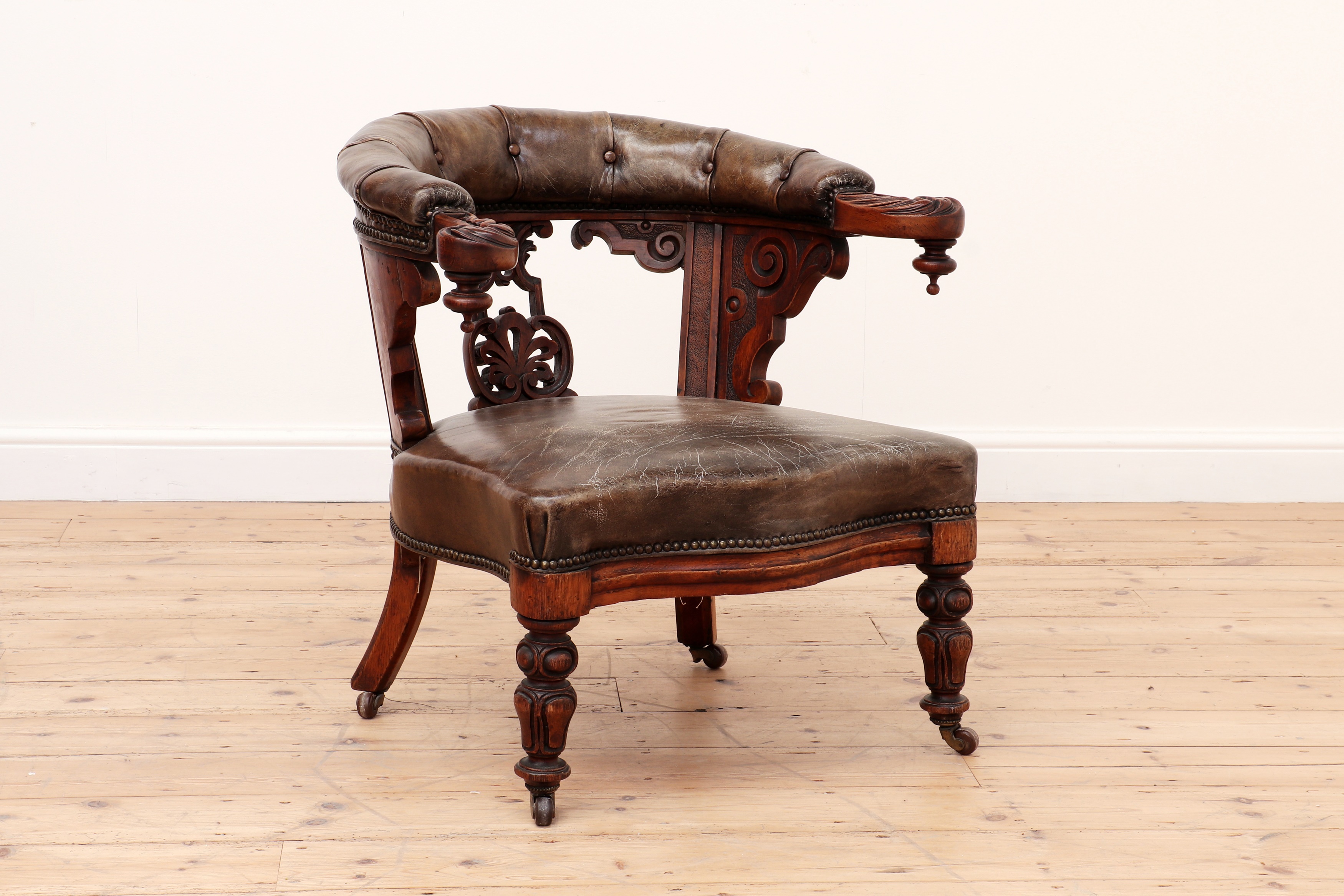 An oak and leather armchair